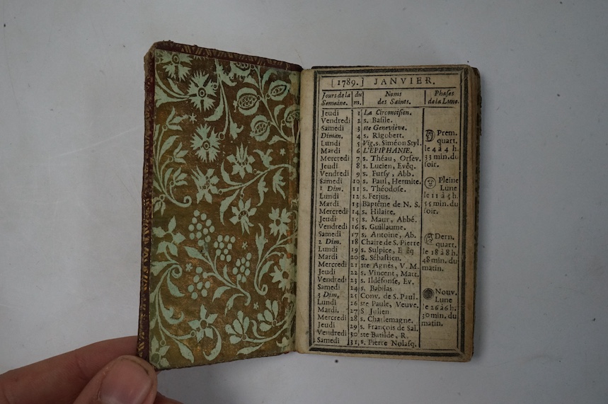 Pocket Book - late 17th/ early 18th century, tooled and gilt red morocco, unused but for an inscription on the first page, 13.2 x 8.5cm; French almanac for 1789, rococo Ducal? binding, 9.7 x 6cm. (2)